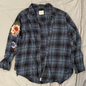 Teal Flannel with distressed bottom and embroidered flower sleeve